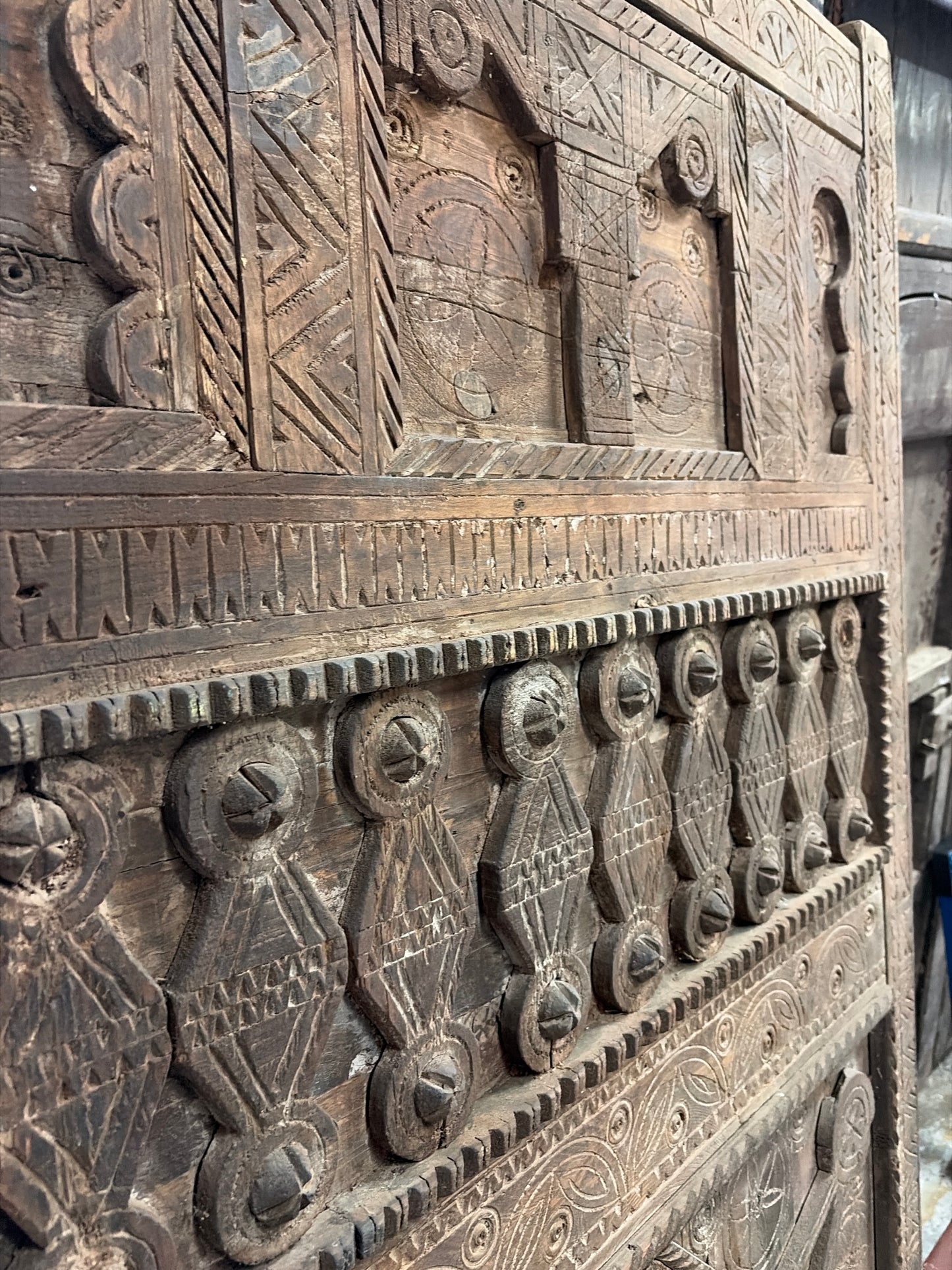Morocco Medina Large Antique Hand-Carved Dark Wood Panel Door with Intricate Geometric Patterns and Central Rosette Motif