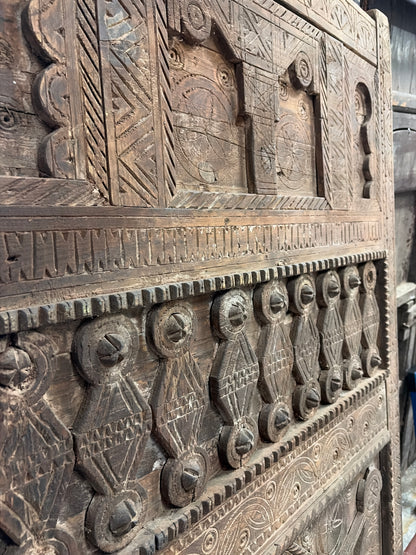 Morocco Medina Large Antique Hand-Carved Dark Wood Panel Door with Intricate Geometric Patterns and Central Rosette Motif