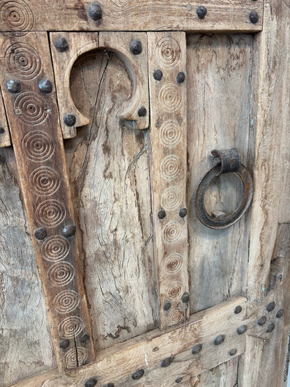 Morocco Medina Antique Natural Wood Paneled Door with Carved Horseshoe Arches, Concentric Engravings, and Iron Ring Pull