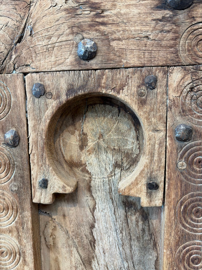 Morocco Medina Antique Natural Wood Paneled Door with Carved Horseshoe Arches, Concentric Engravings, and Iron Ring Pull